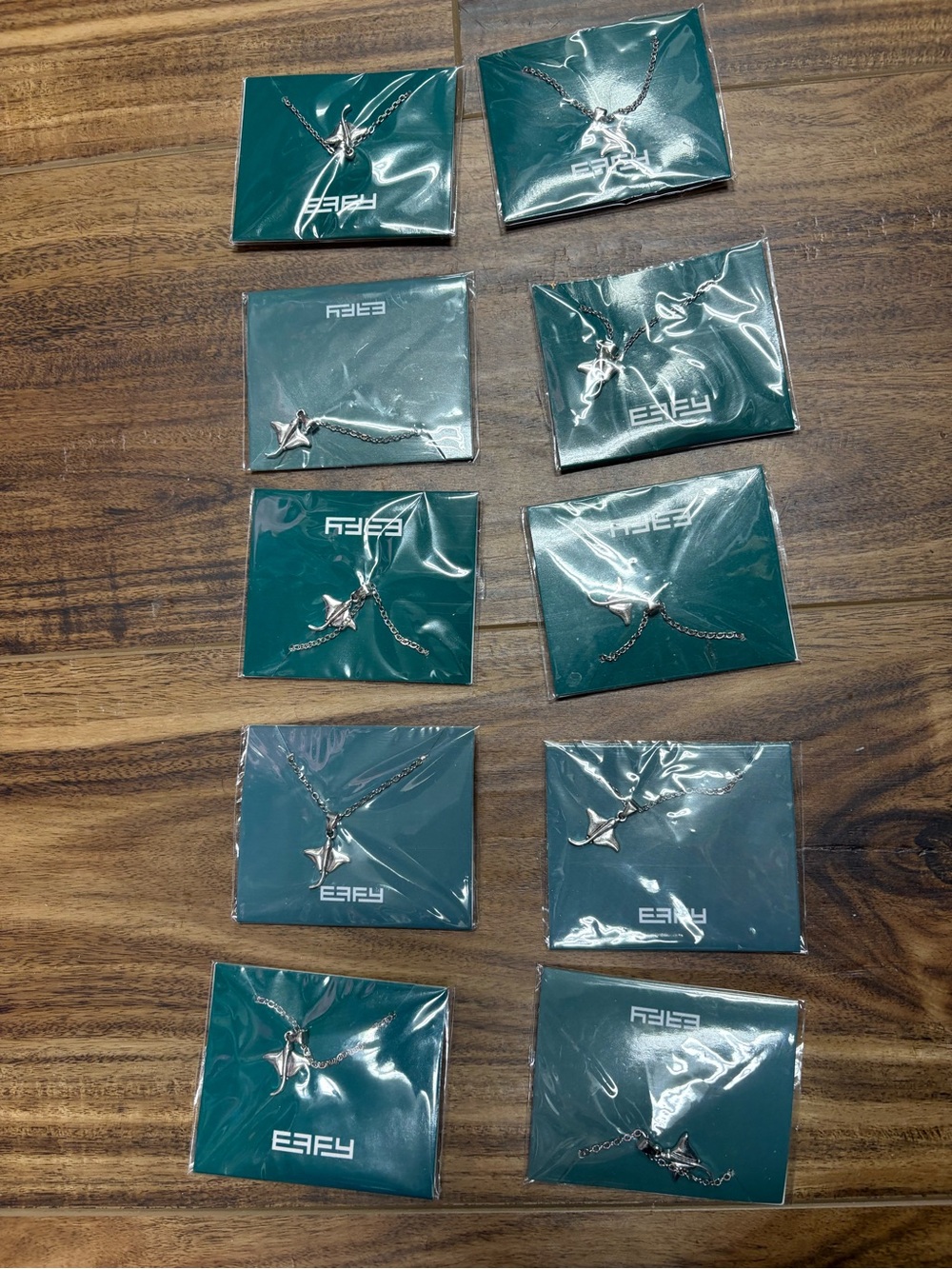 Lot of 10 Effy stingray silver tone necklaces, new in packaging